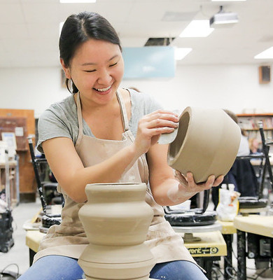 Student in pottery class