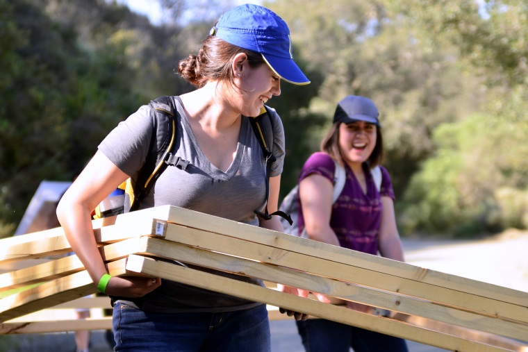 Yvette Ramos and Daniela Maureen carry framework for team Helio’s structure on to Poly Canyon.