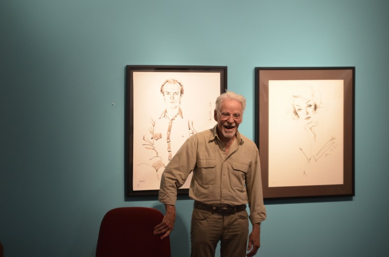 Artist Don Bachardy stands in front of his Jack Nicholson portrait and begins the question and answer session at the Southwestern College Art Gallery