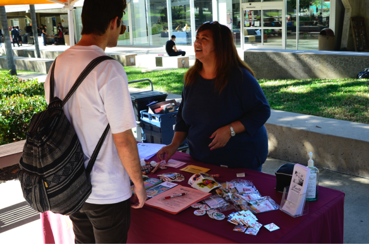During the Great American Smokeout event, Southwestern College Campus Nurse Grace Cruz, RN, MSN talks to a student about the smoke free policy and resources available from Health Service