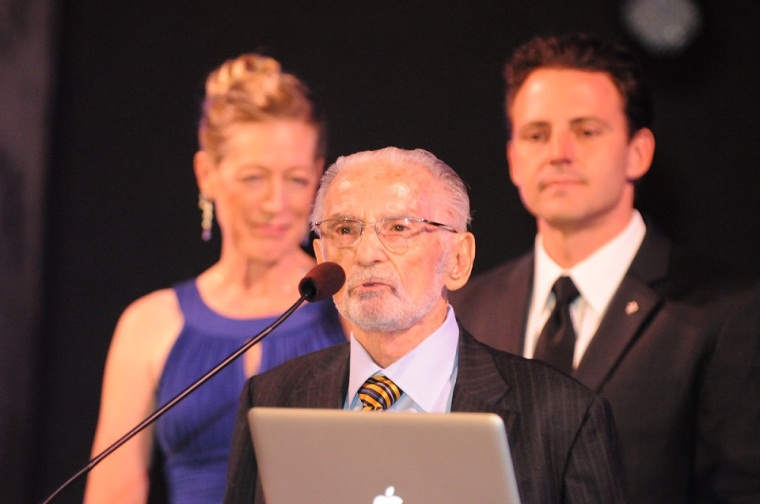 WW2 Veteran Irv Refkin presents flag to the college