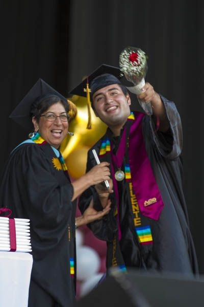Presenter Sylvia Felan Gonzales handing student Manuel Gonzalez his degree during the Southwestern College Commencement Ceremony on June 3, 2014