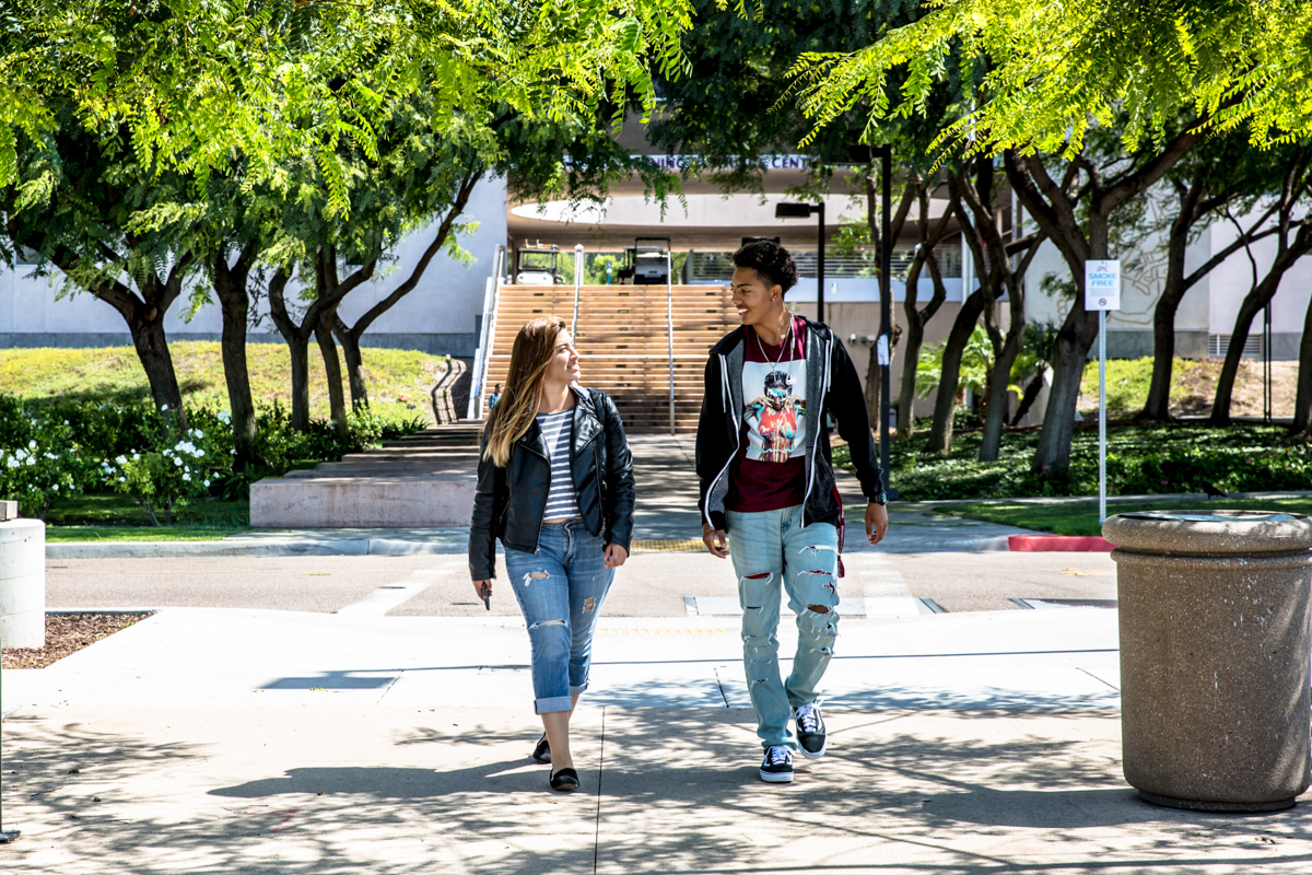 Two students walking Two students walking