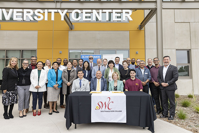 Group photo of Southwestern College and California State University of San Marcos leadership with signed memorandum of understanding. Group photo of Southwestern College and California State University of San Marcos leadership with signed memorandum of understanding.