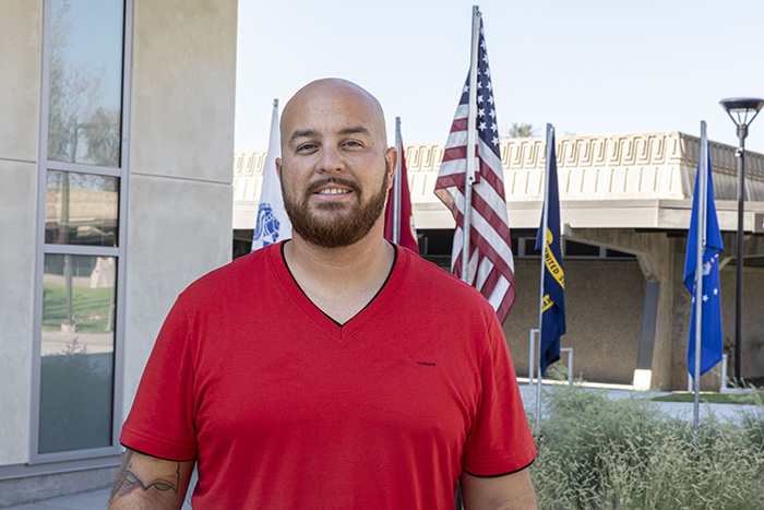 SWC Veterans' student, Luis Gonzalez in front of the Veterans Resource Center in the Student Union.