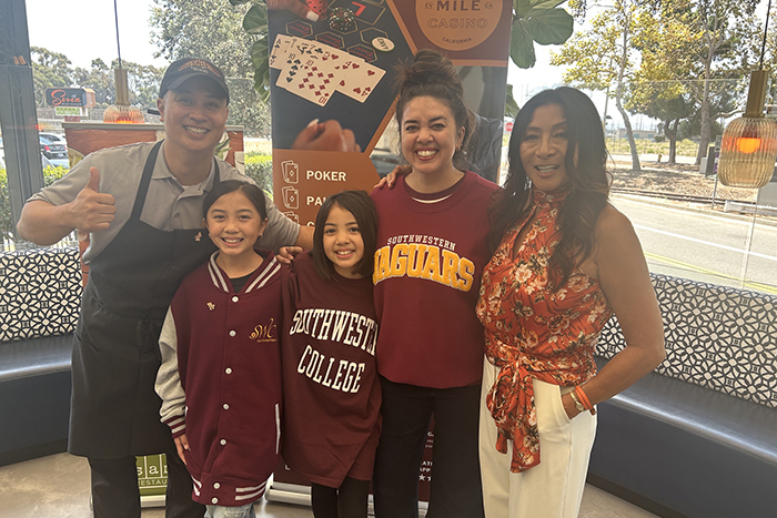 Southwestern College Professor of Culinary Arts, Kris Saradpon with his family and Linda Rosas after winning the Seven Mile Casino Sammy's Restaurant & Bar Messy Sundae competition.