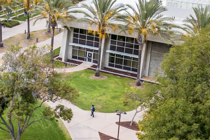 Aerial view of cesar chavez building with surrounding foliage