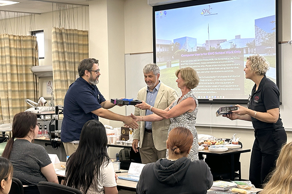 Southwestern College Vocational Nursing student receiving their class materials from the Lookabough Foundation.