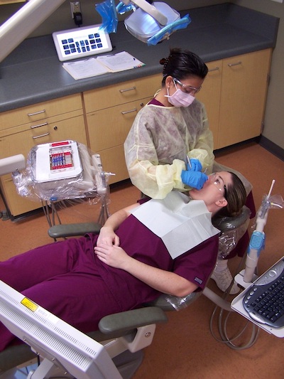 Photo of Dental Hygiene Student with Patient Photo of Dental Hygiene Student with Patient