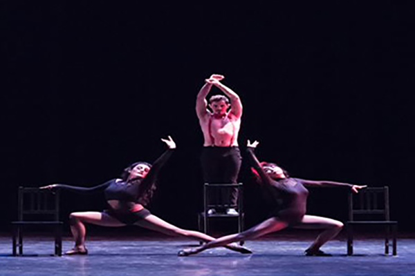 dark photo of a student dance performance
