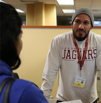 student services employee assisting student