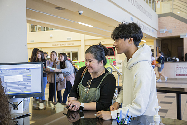 Student receiving assistance at the Admissions & Records Department.