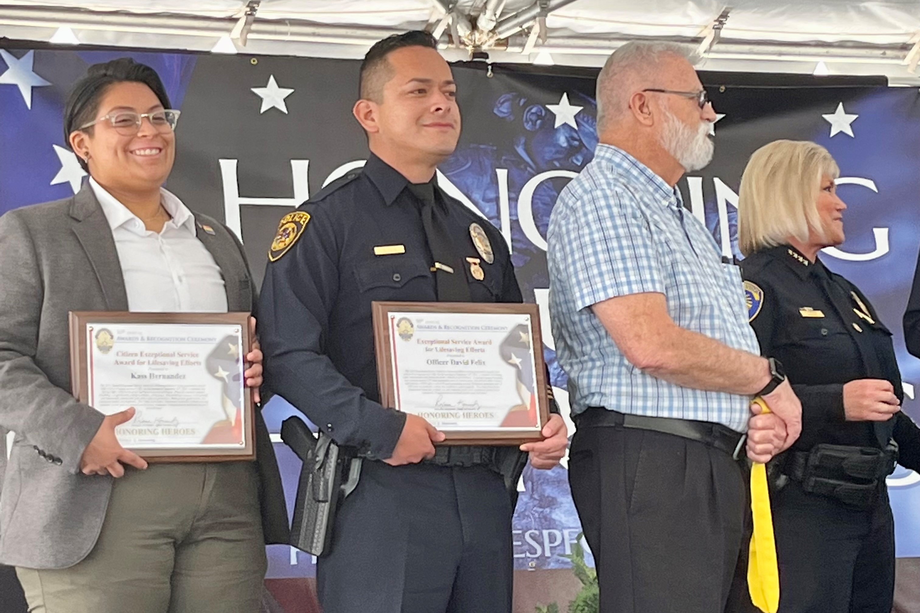 Officer Felix accepting an award