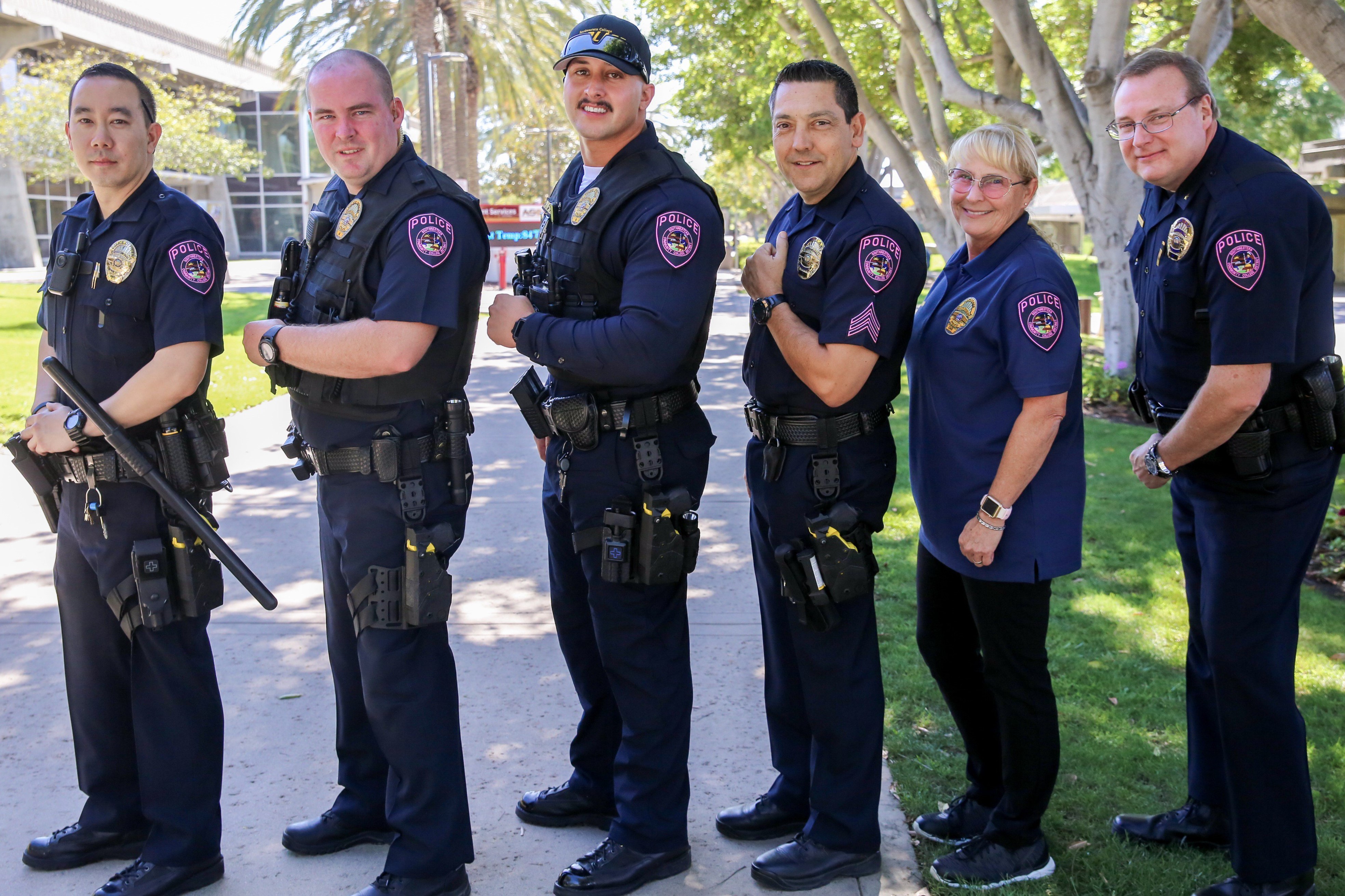 SWCPD showing off their pink badges for Breast Cancer Awareness Month