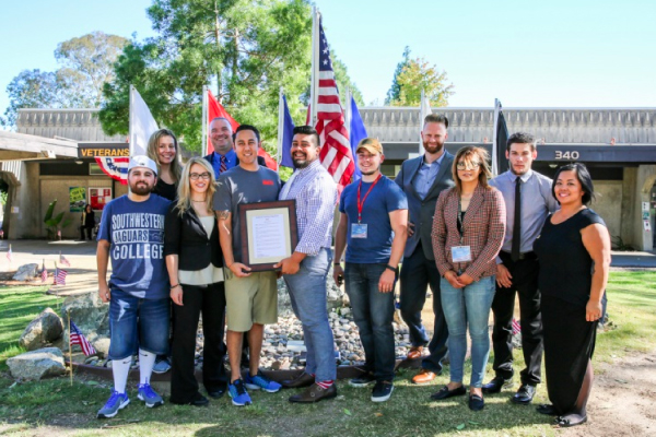 A group of veterans posing in front of the Veterans Resource Center A group of veterans posing in front of the Veterans Resource Center