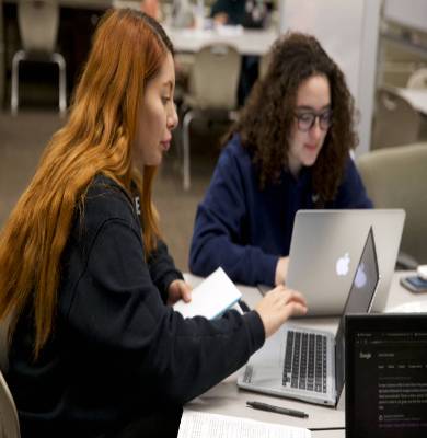 Two women studying